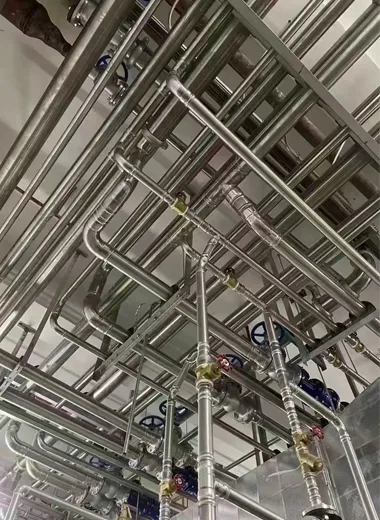Stainless steel water supply piping system installation in modern building construction