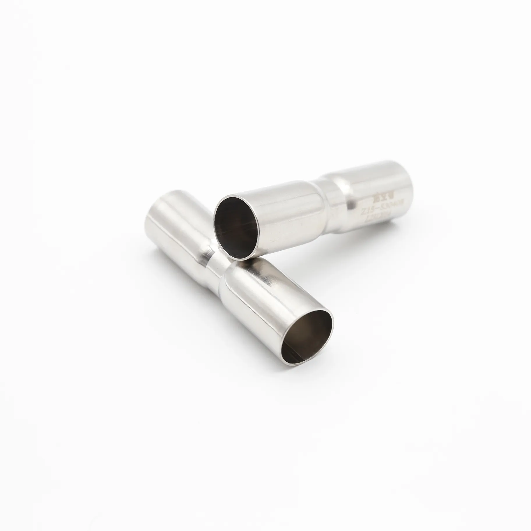 Two short pipe sections inserted into either end of a coupling, demonstrating its assembly and function.