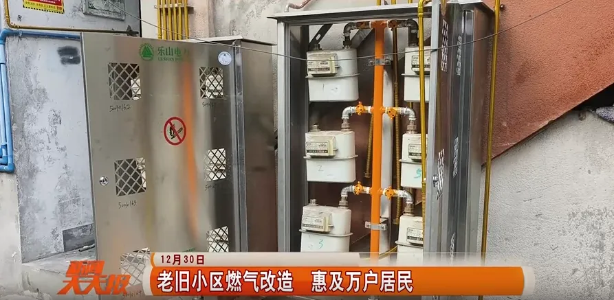 A newly installed residential gas meter box, with clean stainless steel supply pipes connected, mounted neatly on a building exterior.