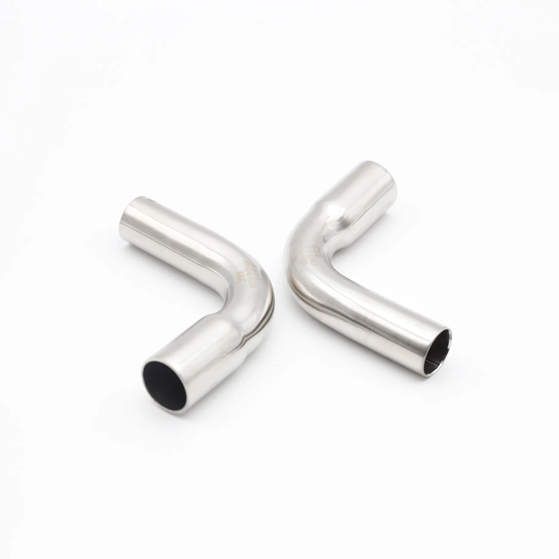 Two B-Type elbows arranged at complementary angles, with one shown near a representation of a pipe (for socket end) and a welding symbol (for plain end).