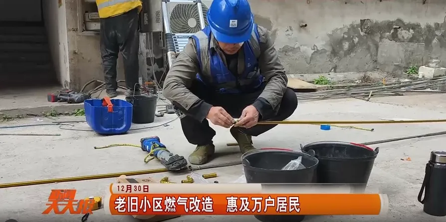 Technician preparing stainless steel gas pipe components for residential renovation