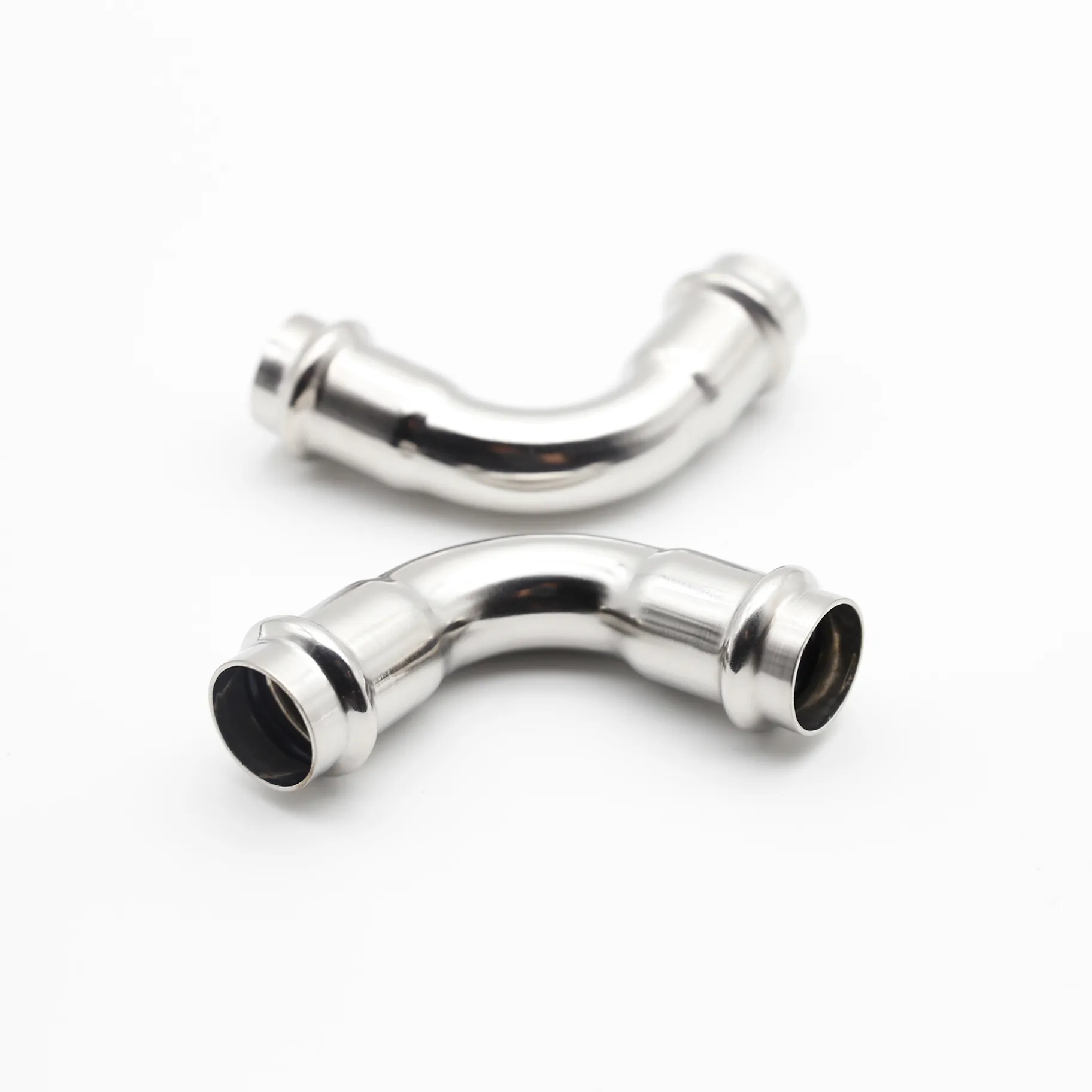 Two identical Type A 90-degree elbows placed side-by-side on white.