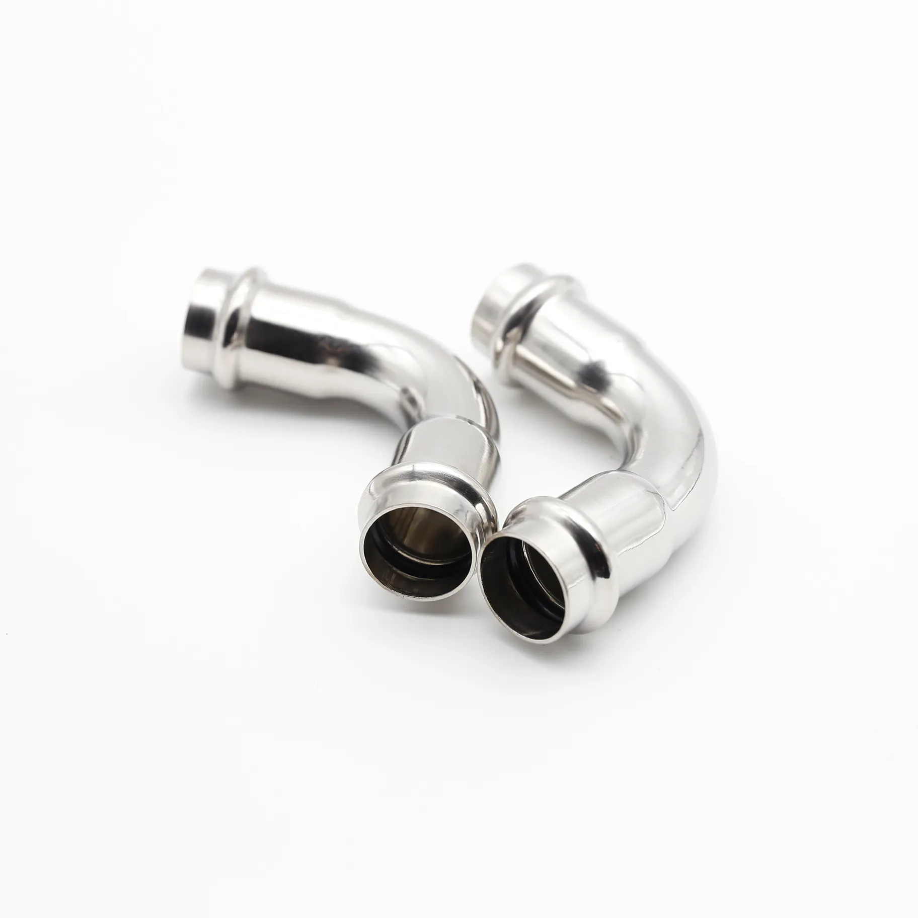 Two elbows arranged to suggest a pipeline making two 90-degree turns.