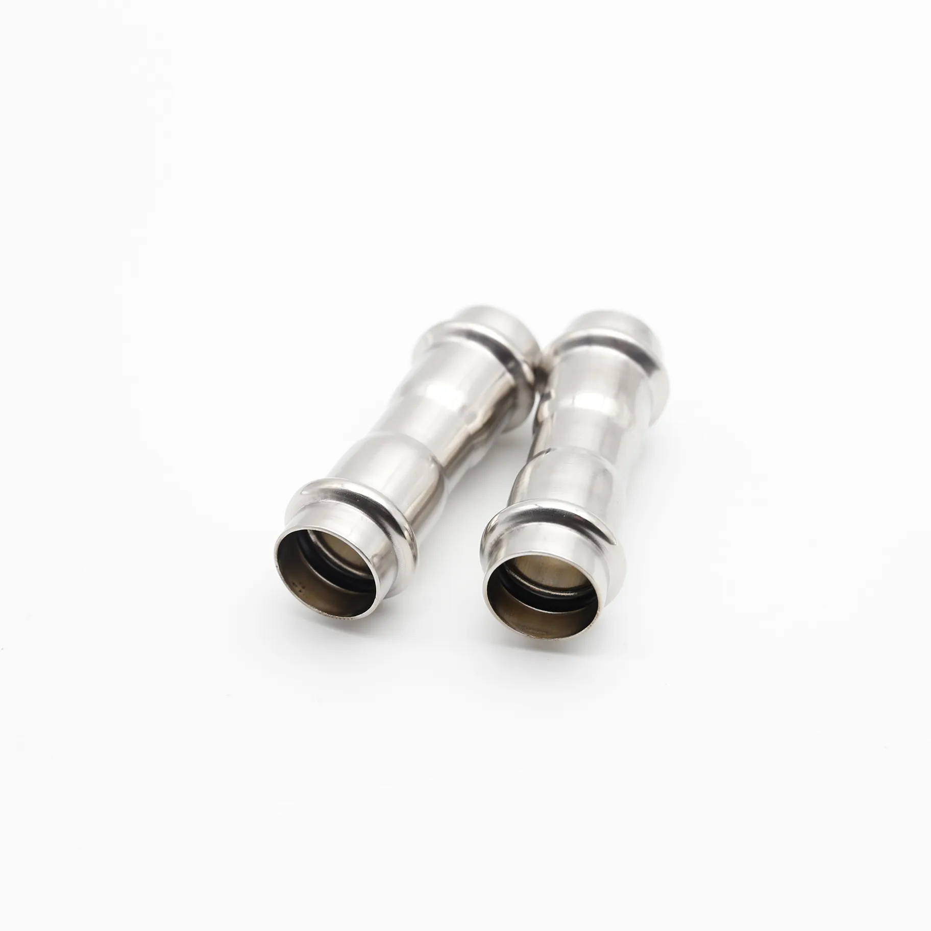 Two straight couplings positioned at staggered angles on a white background, giving a three-dimensional perspective.