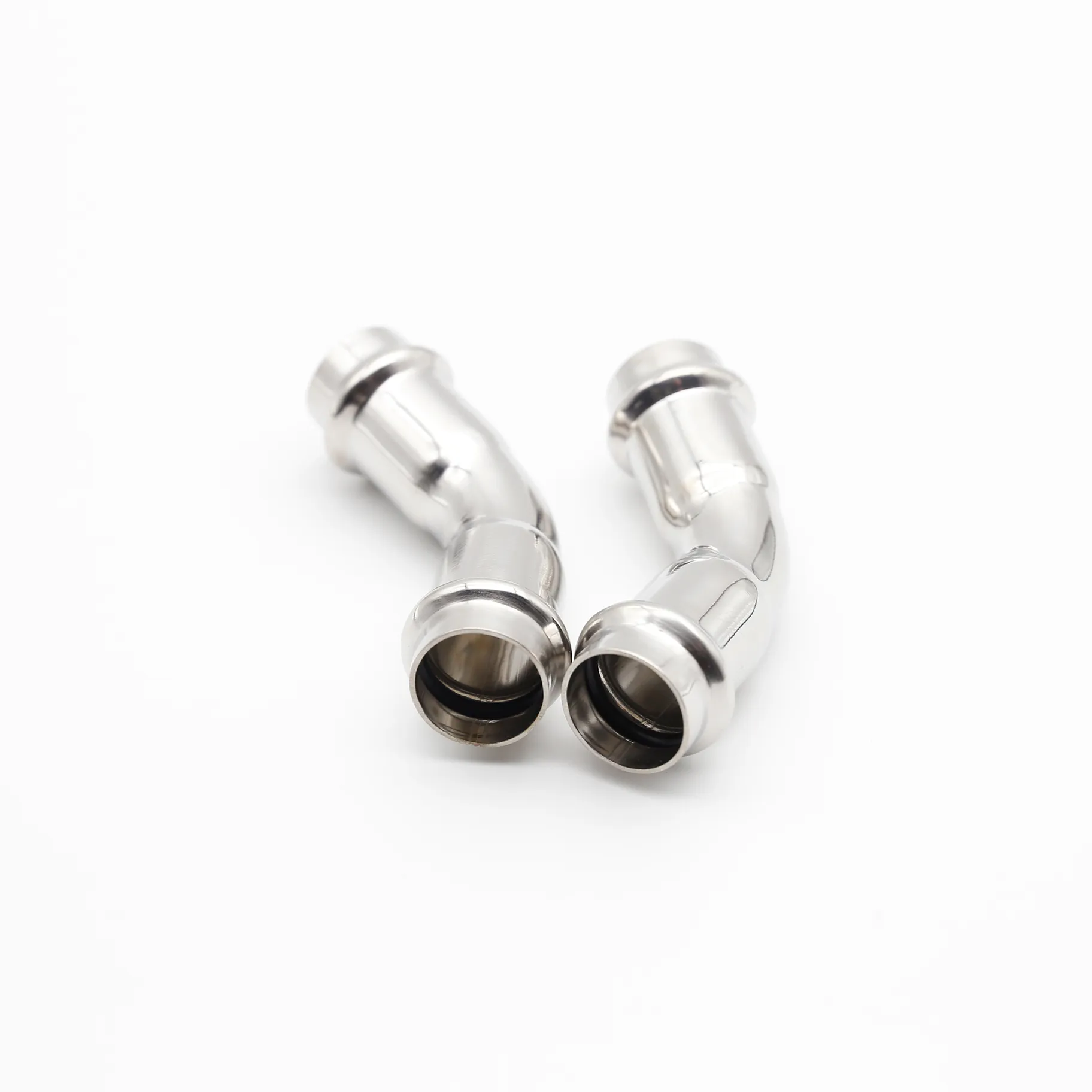 Two 45-degree elbows positioned to illustrate how they can be used together to create a parallel pipe offset.