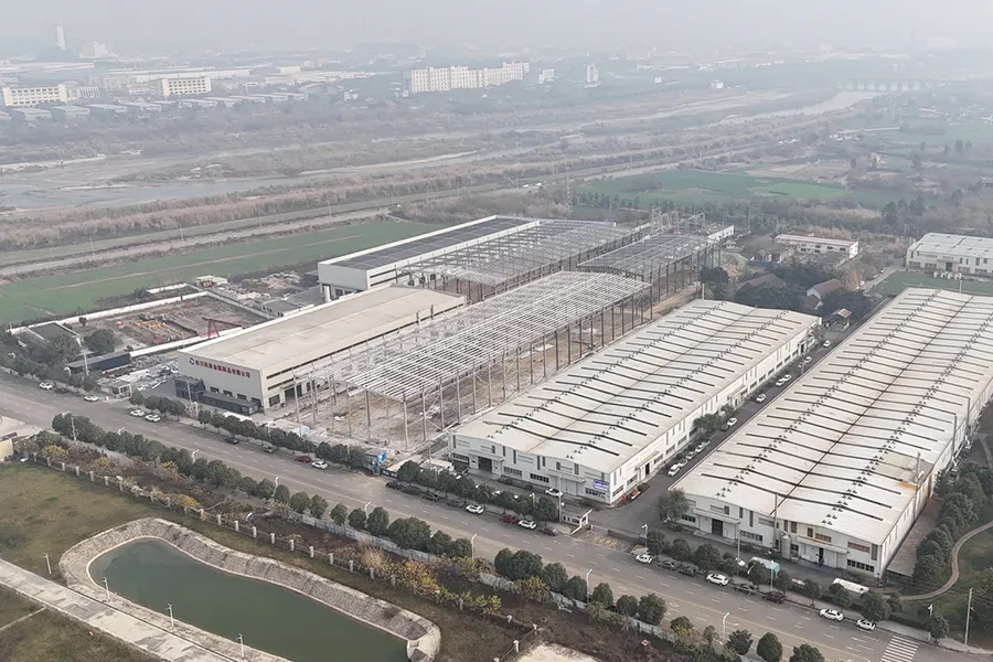 Aerial view of large-scale stainless steel pipe factory with multiple production buildings