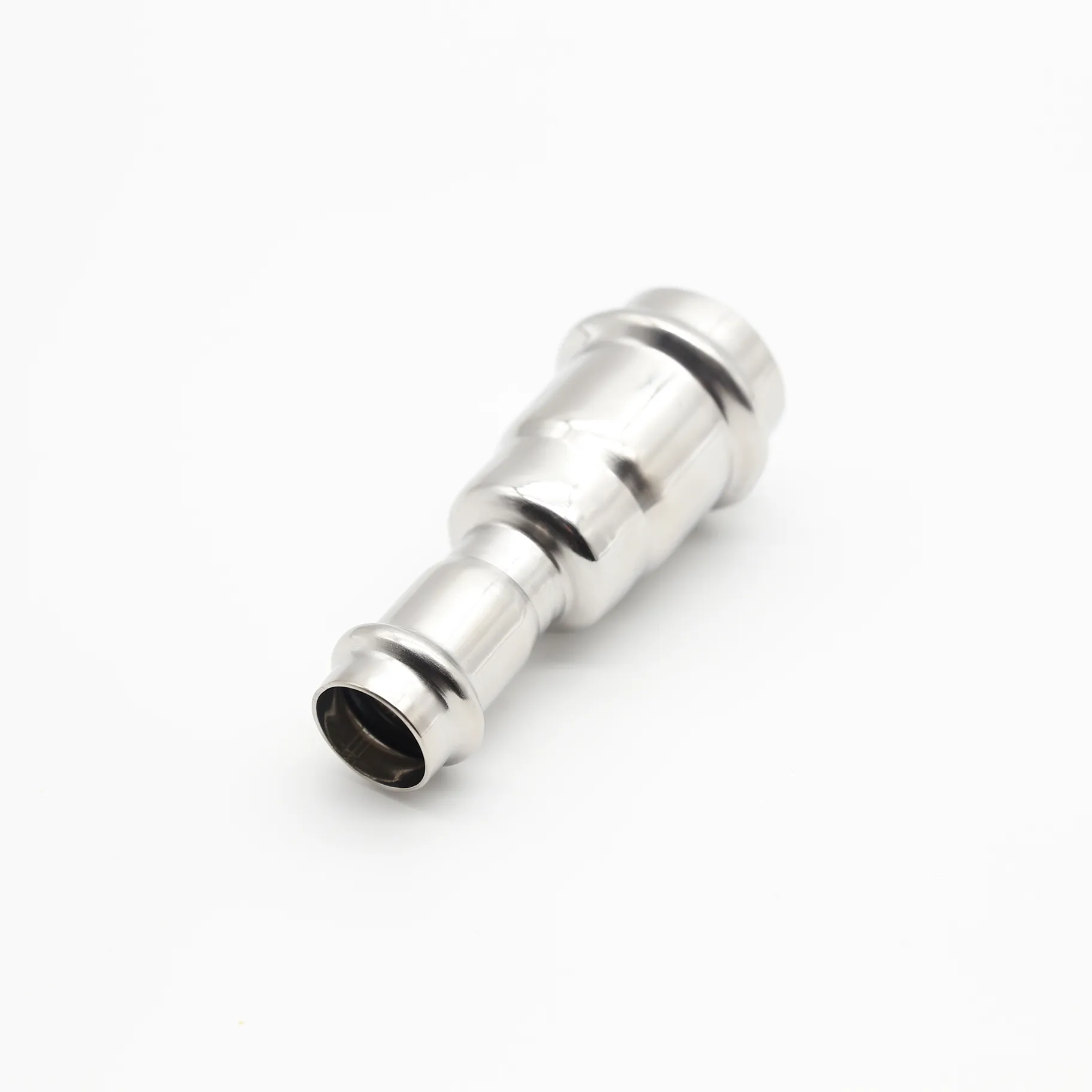 Reducing coupling with double-press connection ends