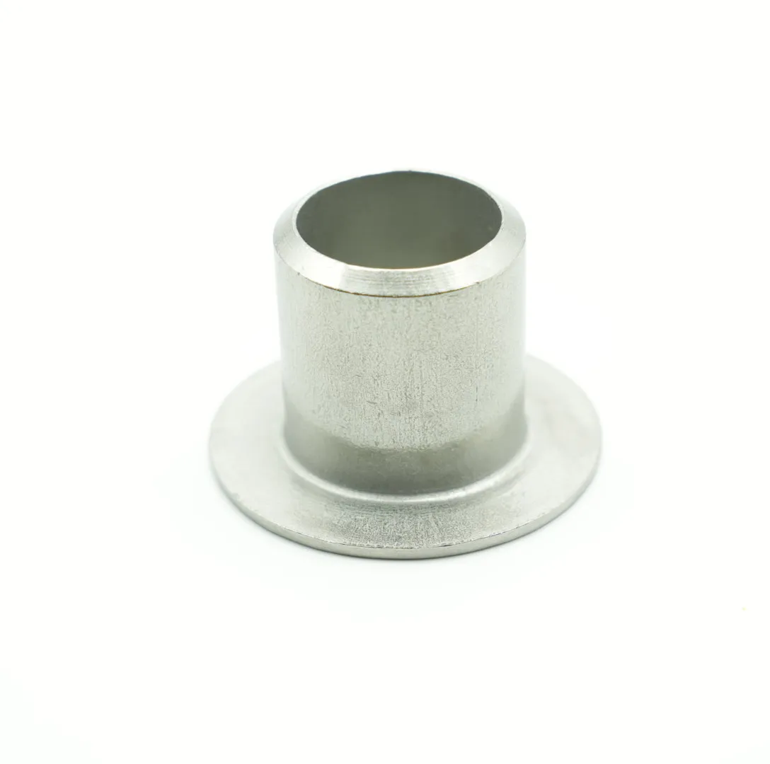 Direct view looking onto the machined lap face of a stub end, showing the smooth sealing surface and raised face profile