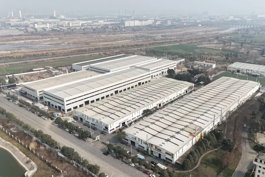Aerial view of large-scale stainless steel pipe factory with multiple production buildings